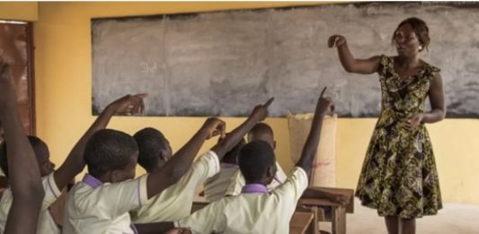 Ghanaian teacher teaching her students